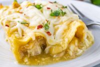 Cheesy Shredded Chicken Enchiladas with Green Chile Sauce