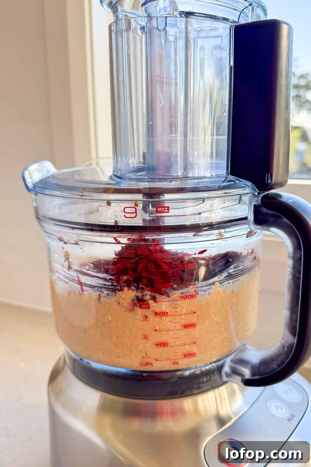 Grated beetroot added to the food processor.