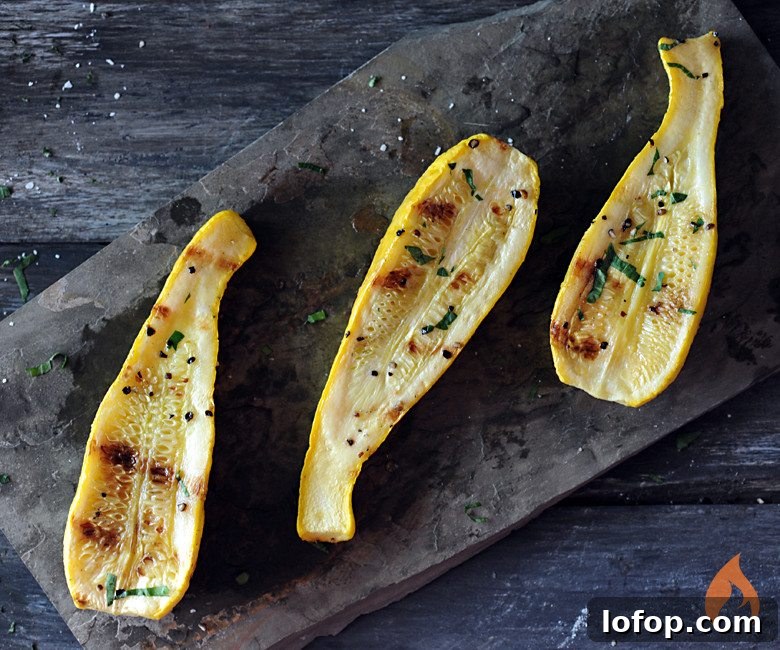 Perfectly Grilled Yellow Squash Recipe for Summer BBQs 2 grilled yellow squash on slate background