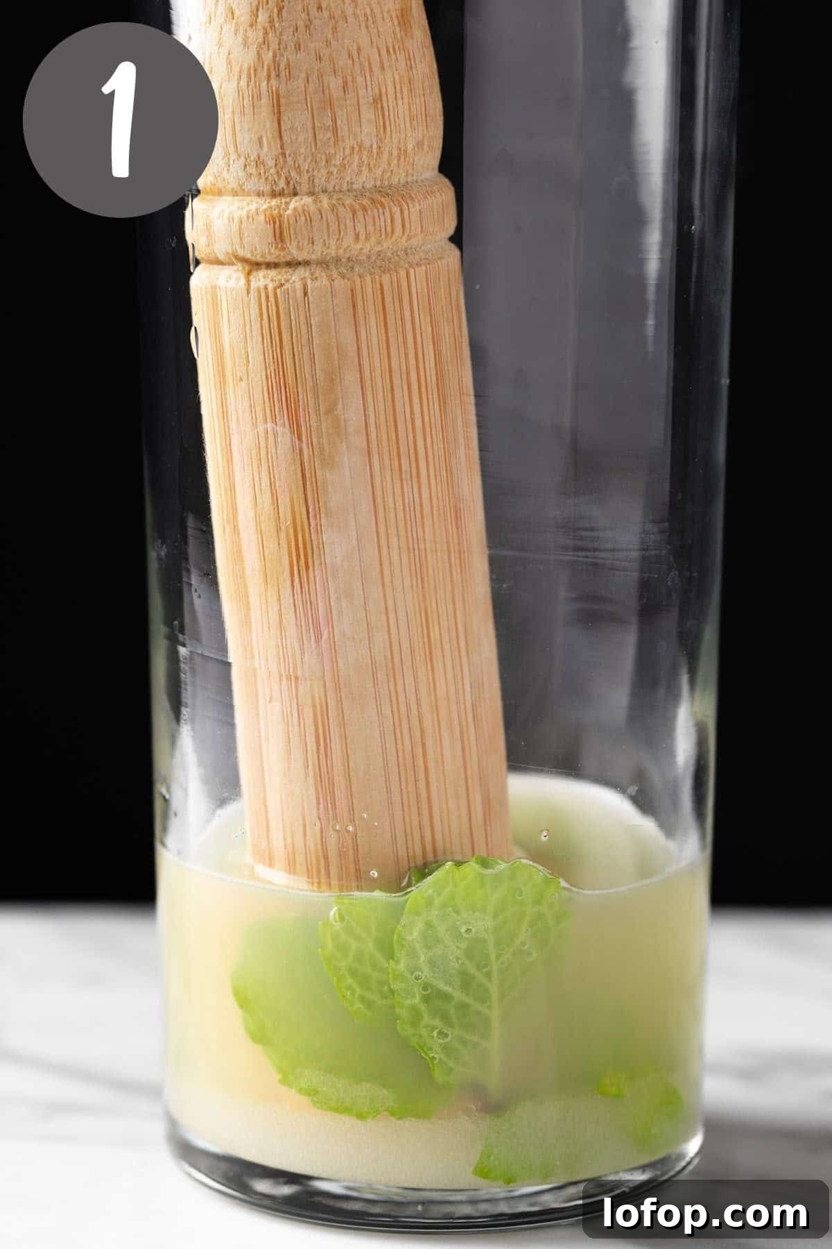 Ginger Ale Mojito Recipe: Refreshing Mint Cocktail Guide 4 Muddling the mint leaves, lime juice and sugar together in a highball glass.