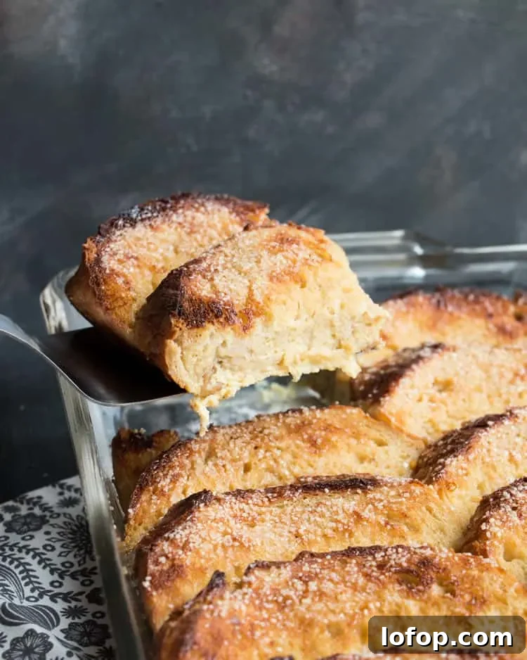 Overnight Eggnog French Toast. Easy, festive, make ahead breakfast. Hearty slices of bread baked in a creamy eggnog custard with a crunchy sugar topping!