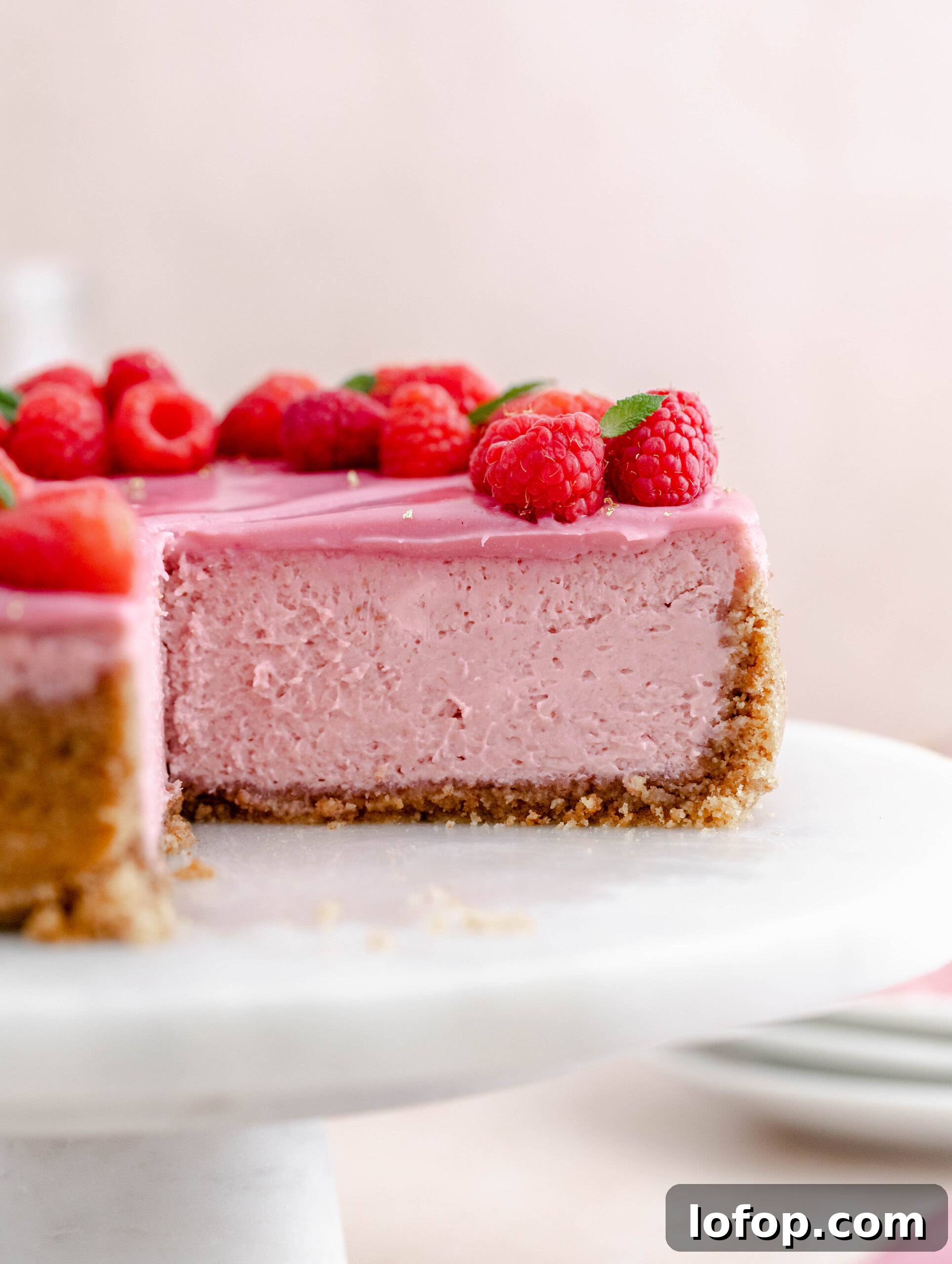 Decadent Raspberry Cheesecake Recipe with Fresh Berry Topping 3 Fresh and creamy Raspberry Cheesecake