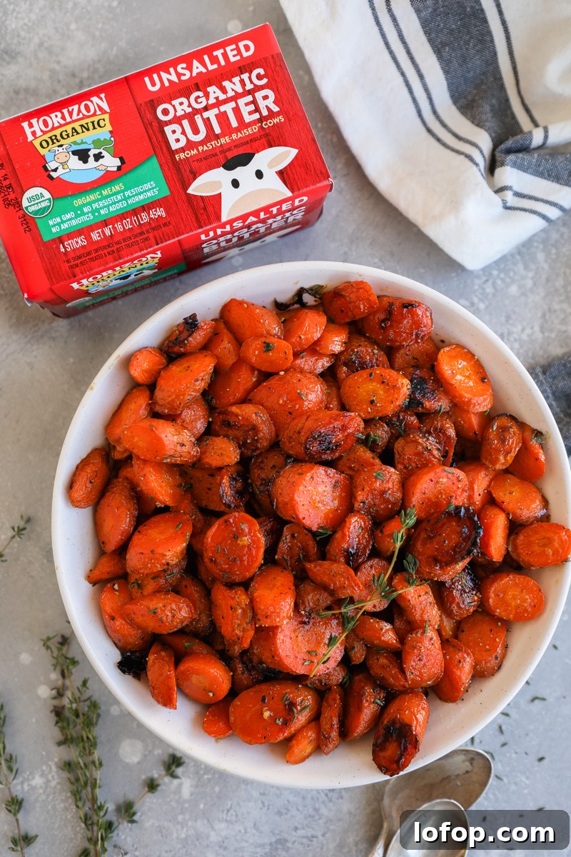 Crispy brown butter carrots served in a white bowl next to a package of Horizon organic unsalted butter