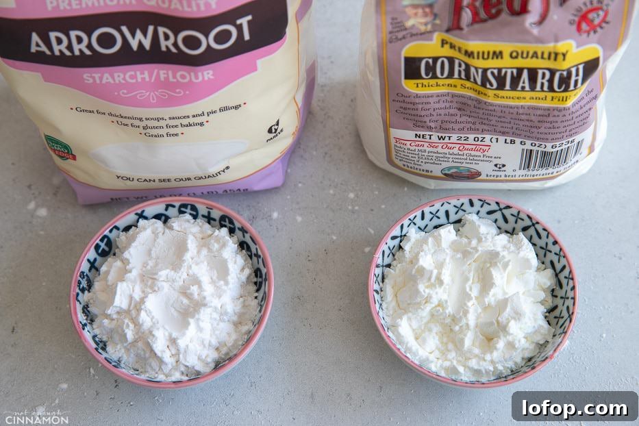 a small bowl of cornstarch next to a bowl with arrowroot flour 