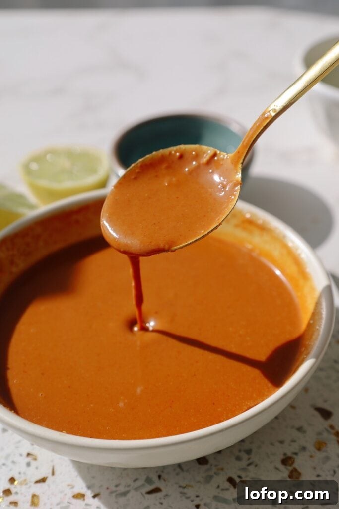 Authentic Spicy Thai Peanut Sauce Recipe for Noodles & Dipping 2 thai peanut sauce dripping