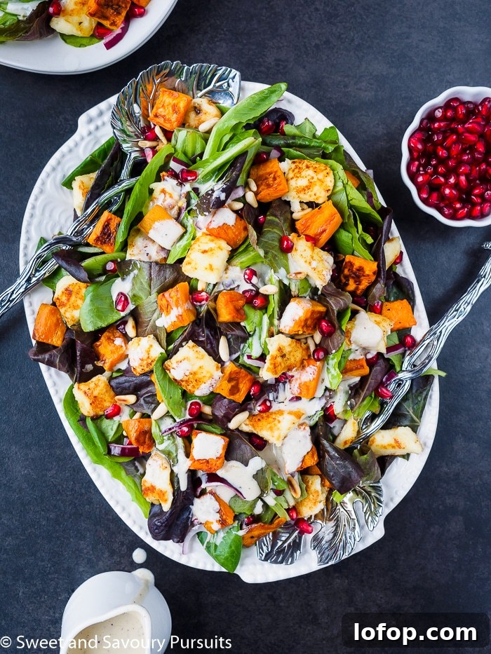 Plate of Roasted Sweet Potato Salad drizzled with Citrus Tahini Dressing
