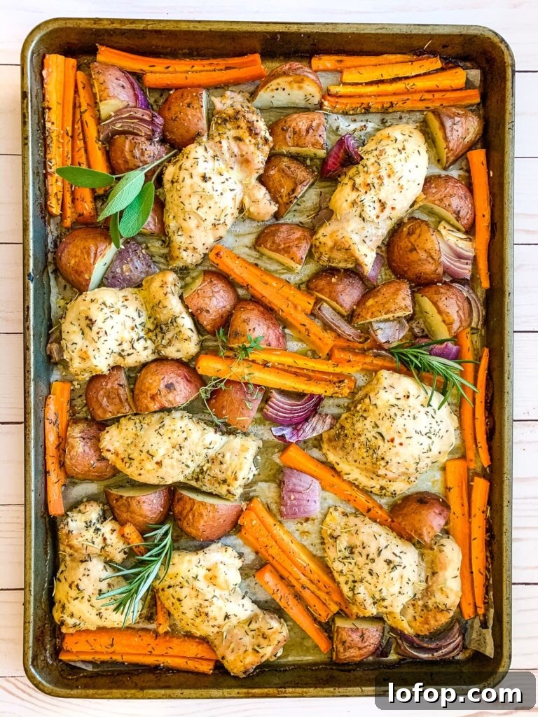 baking sheet of chicken thighs and veggies
