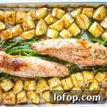 Roasted green beans, pork and potatoes on sheet pan.