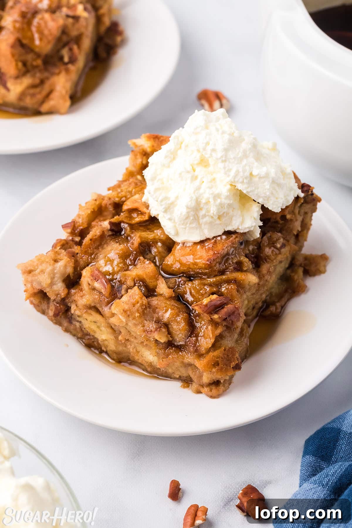 Creamy Pumpkin Bread Pudding with Spiced Caramel Sauce 10 Slice of Pumpkin Bread Pudding with a scoop of whipped cream on top.