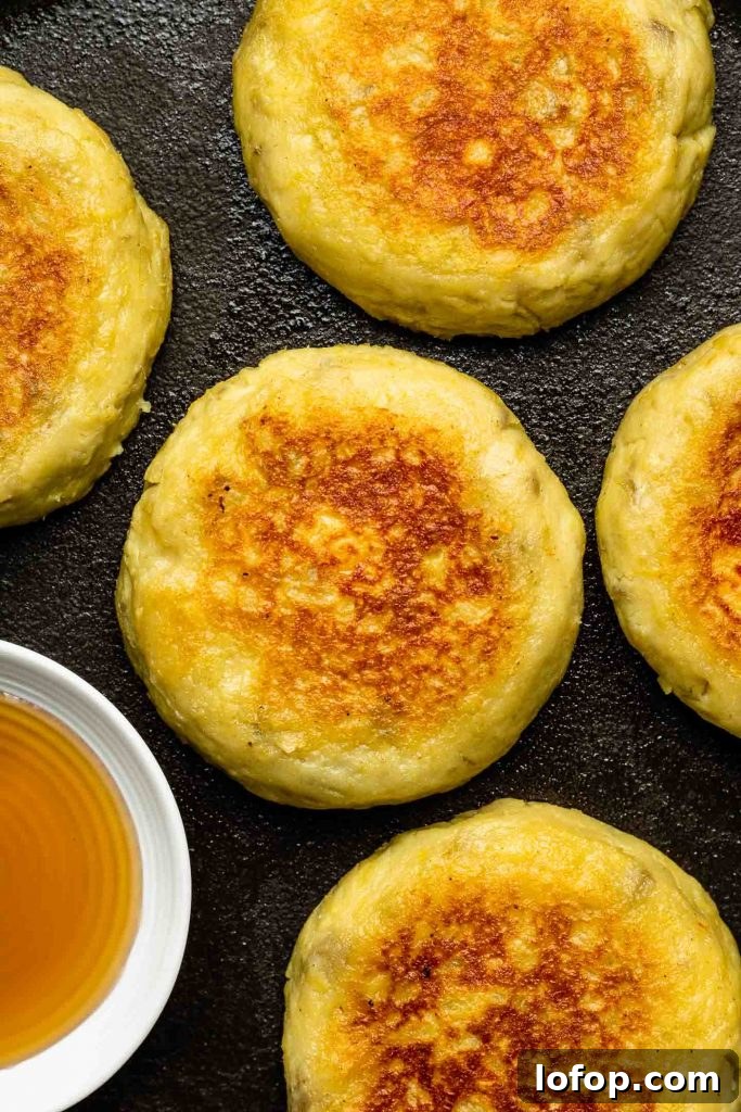 japanese sweet potato  cheese mochi on a black pan with butter