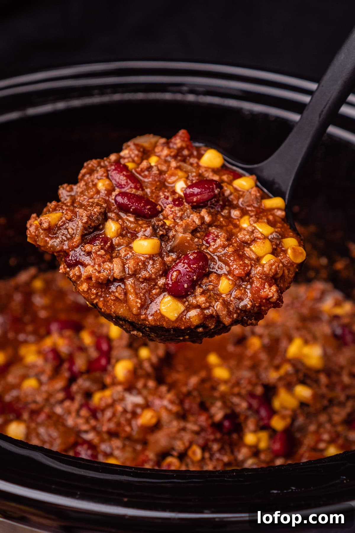 Chilli Con Carne being scooped up with a ladle