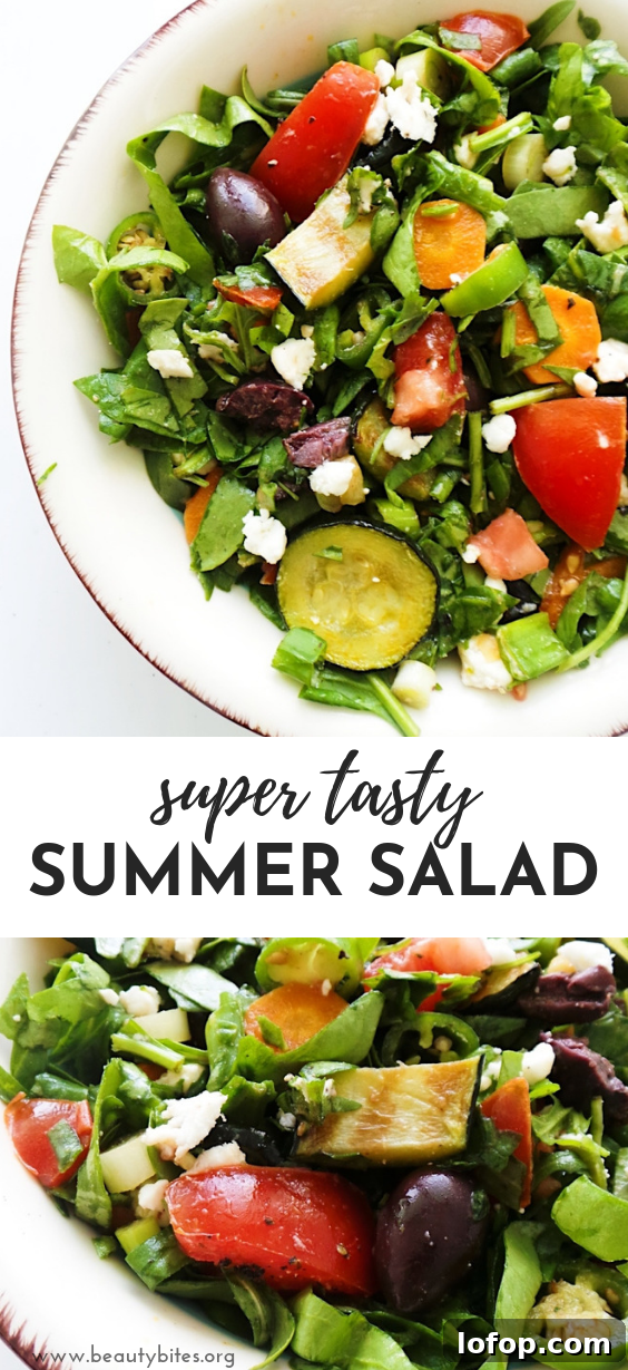 A refreshing and satisfying healthy and easy summer salad with tomatoes, feta cheese, greens, grilled vegetables