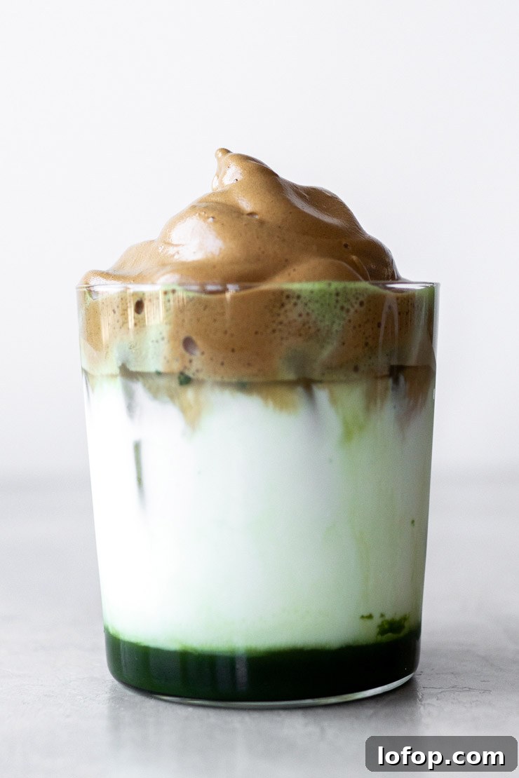 Matcha dalgona coffee in a cup.