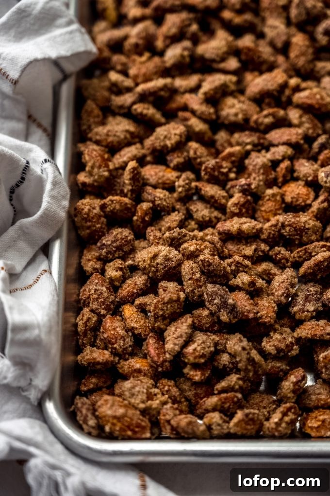 Cinnamon Sugar Candied Almonds Recipe | Crunchy Roasted Almonds 9 Candied almonds on a baking sheet.