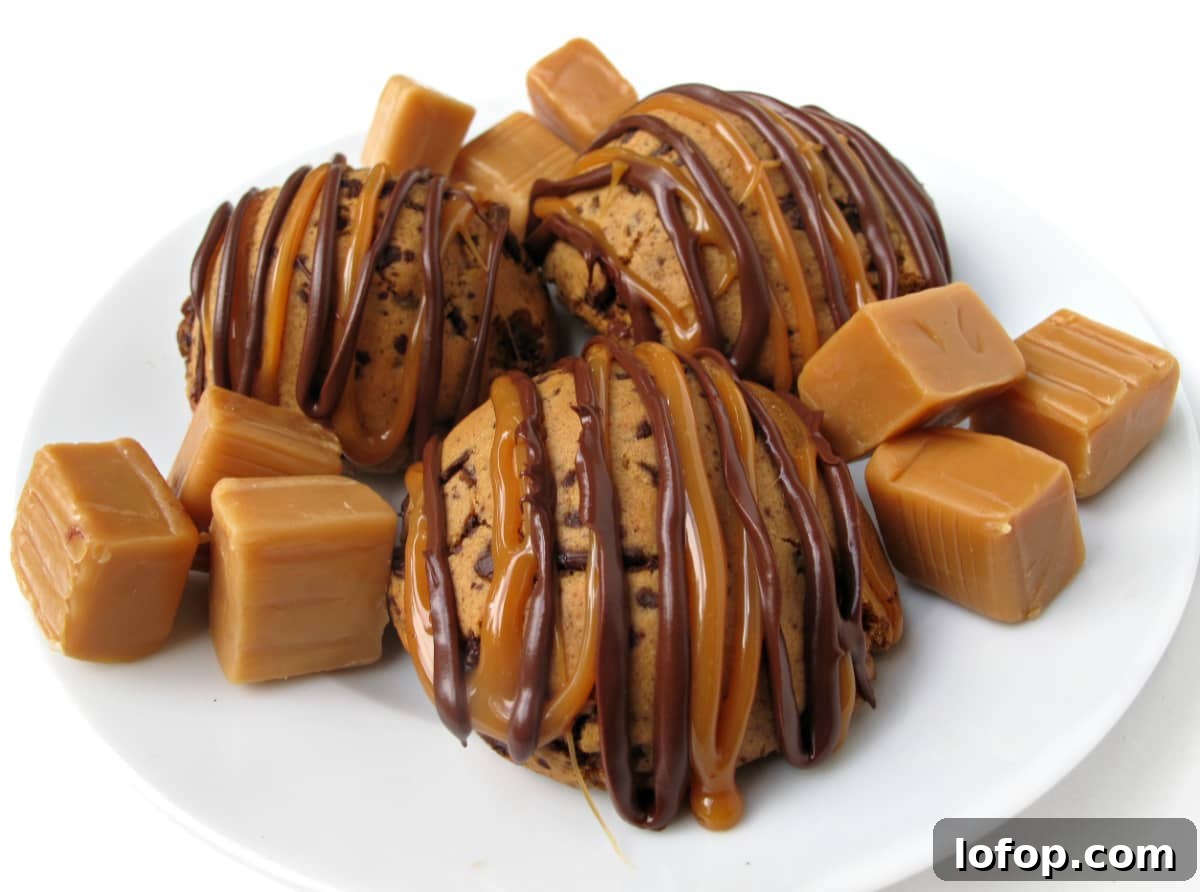 Three Caramel Chocolate Cookies on a white plate with caramel  candy squares. 