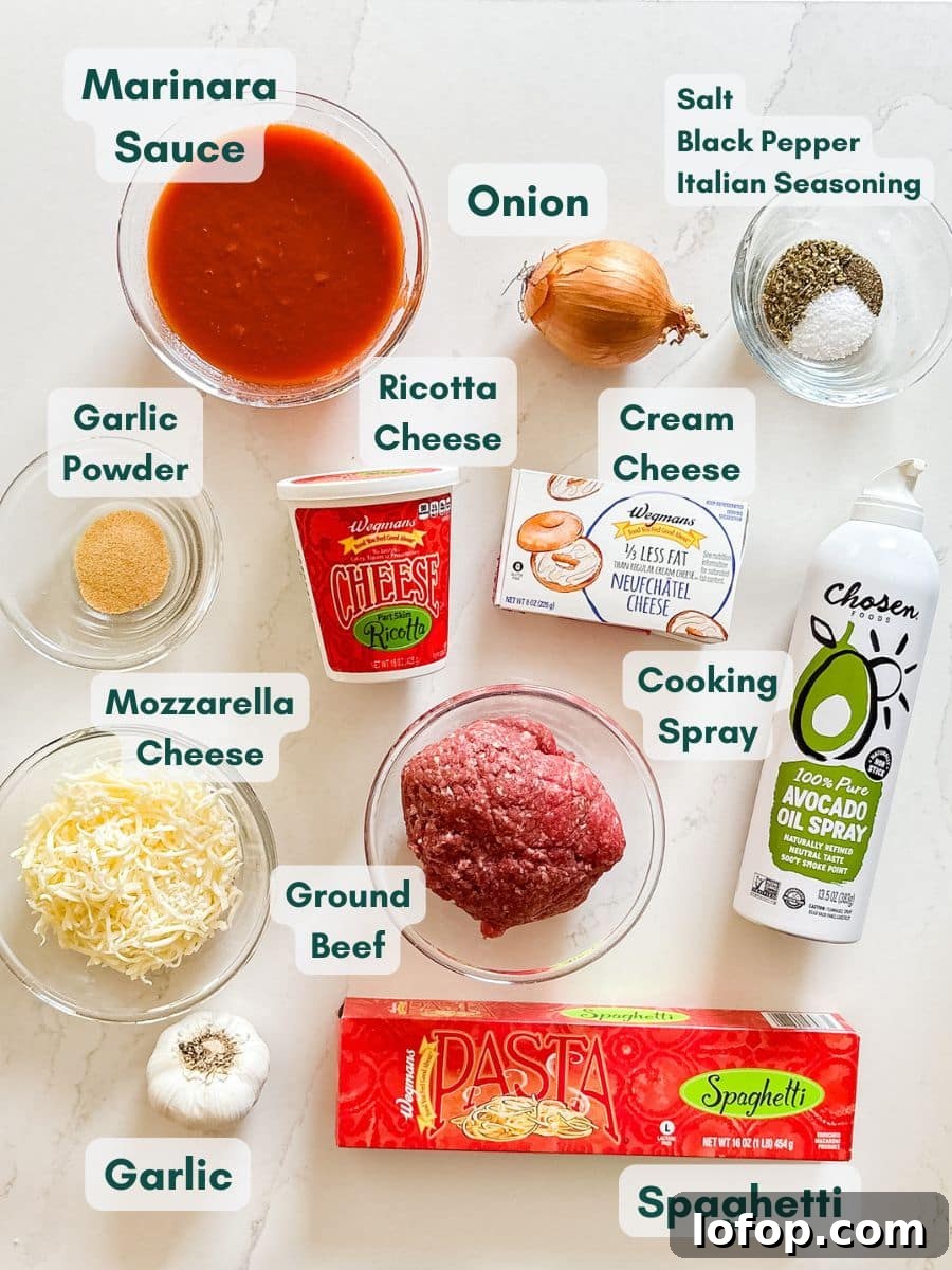 Ultimate Cheesy Baked Spaghetti Recipe for Comfort Dinner 4 An overhead image of labeled recipe ingredients.