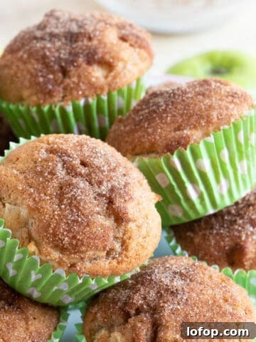 Easy cinnamon apple muffins on a cake stand.