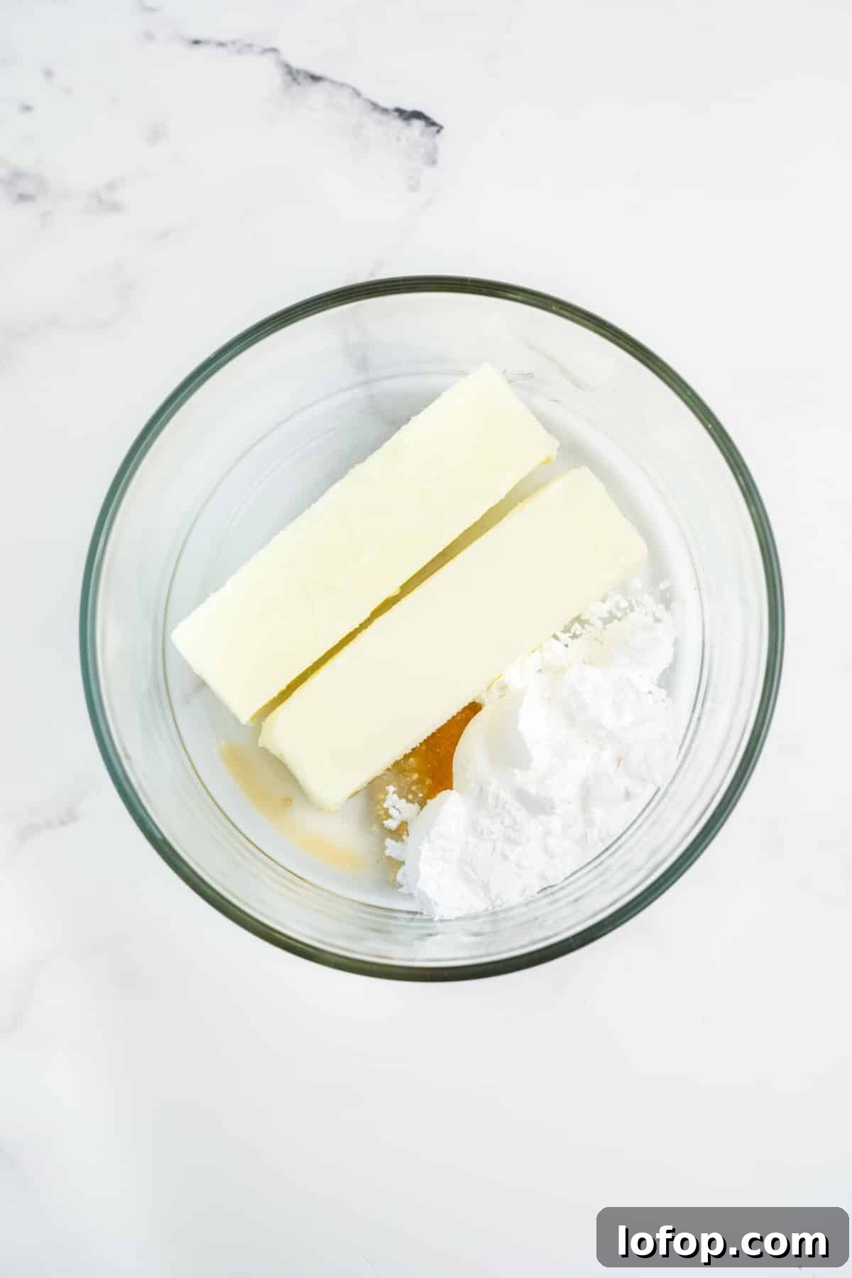 Homemade Strawberry Butter Recipe: Sweet Spread for Toasts and Baked Goods 4 Ingredients for making strawberry butter together in a glass bowl.