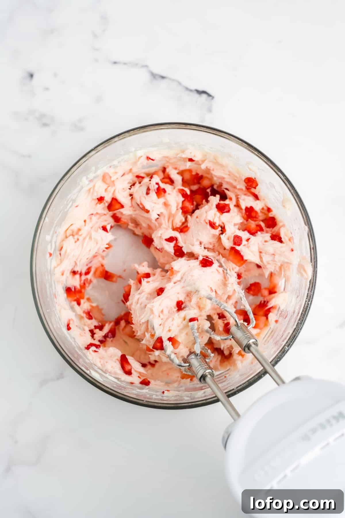 Homemade Strawberry Butter Recipe: Sweet Spread for Toasts and Baked Goods 7 The mixture beaten with a mixer.