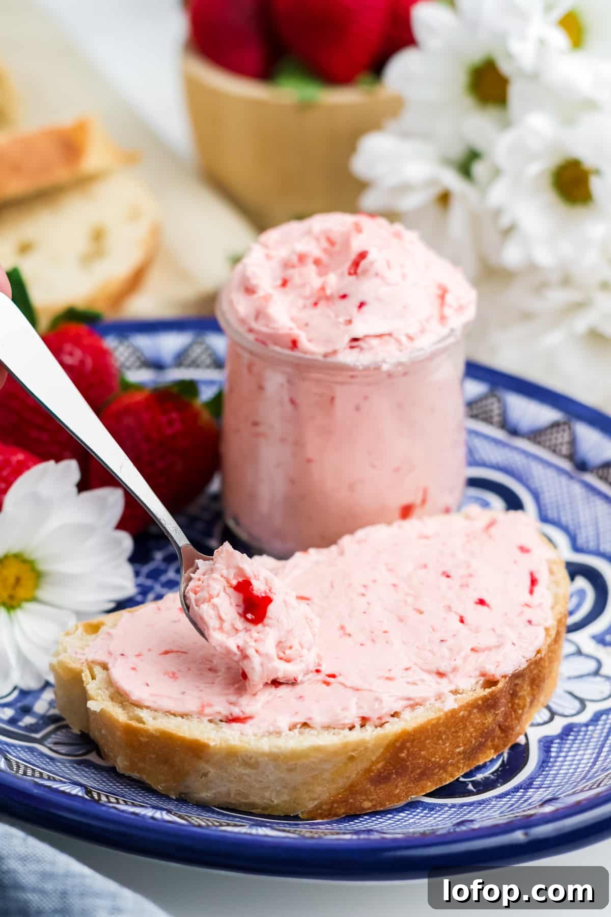 Homemade Strawberry Butter Recipe: Sweet Spread for Toasts and Baked Goods 8 Strawberry butter in a jar and spread on bread.