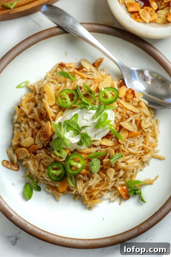 Miso-Marinated Black Cod Recipe for Tender, Flaky Fish 4 Syrian Rice, basmati and fideo on a plate topped with labneh and mint