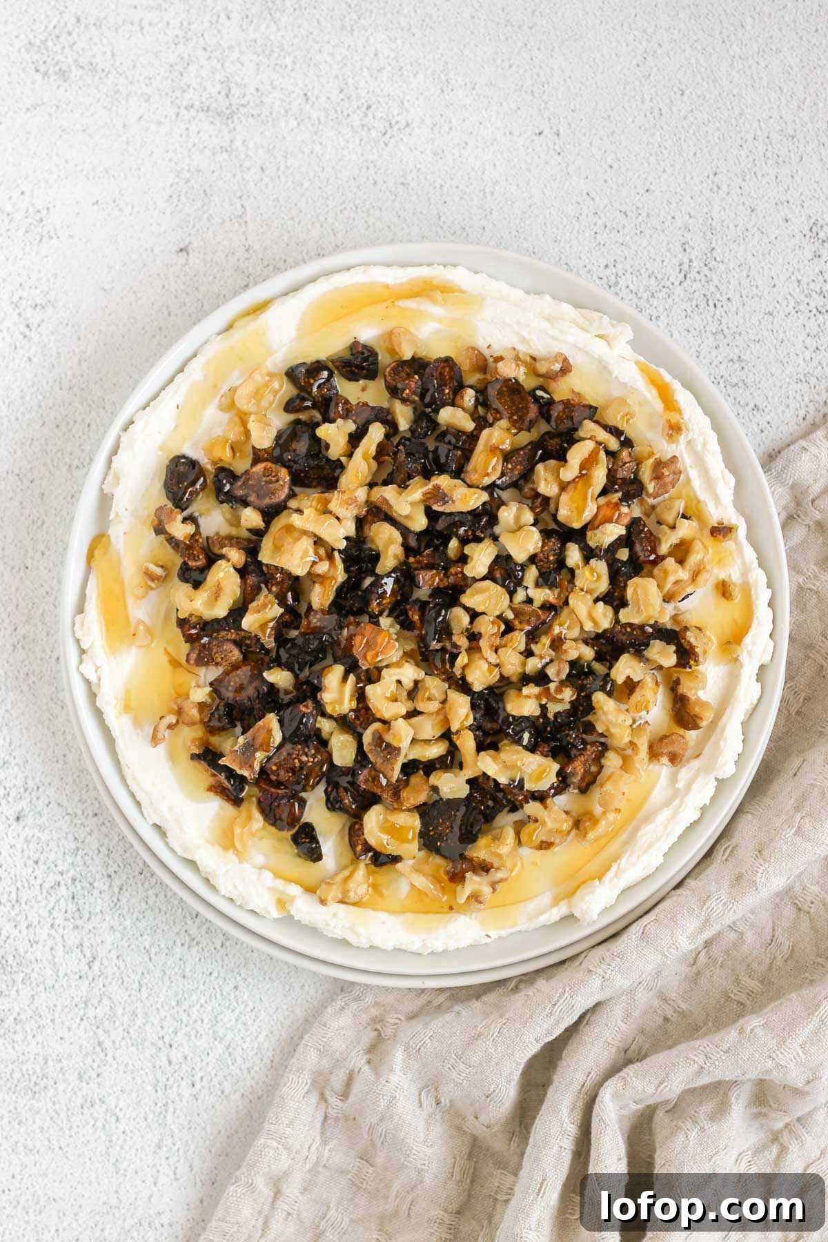 Whipped Goat Cheese and Honey Dip — 5-Ingredient Recipe 7 Whipped goat cheese topped with honey, sliced dried figs and walnuts.