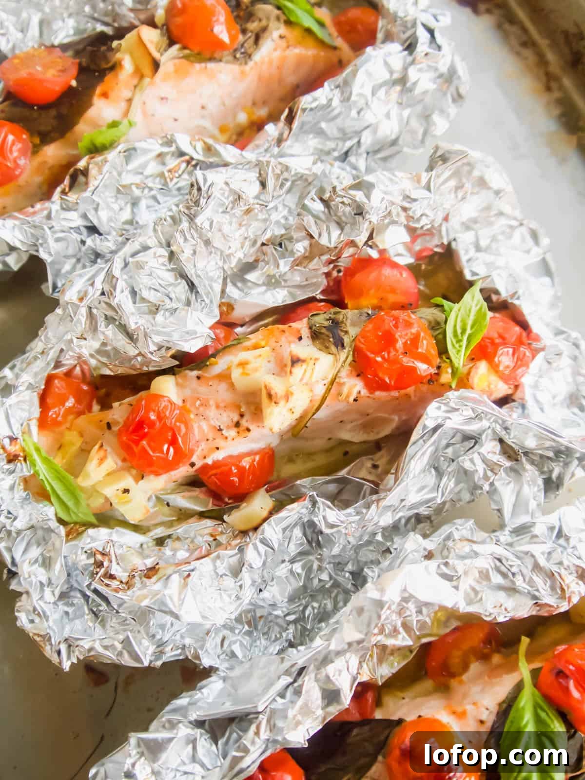 Baked salmon with tomatoes in foil.