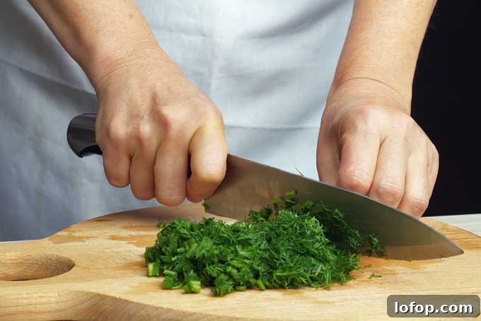 Chopping dill with a chef's knife | Foodal.com