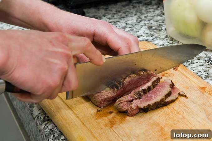 Slicing meat with a chef's knife | Foodal.com
