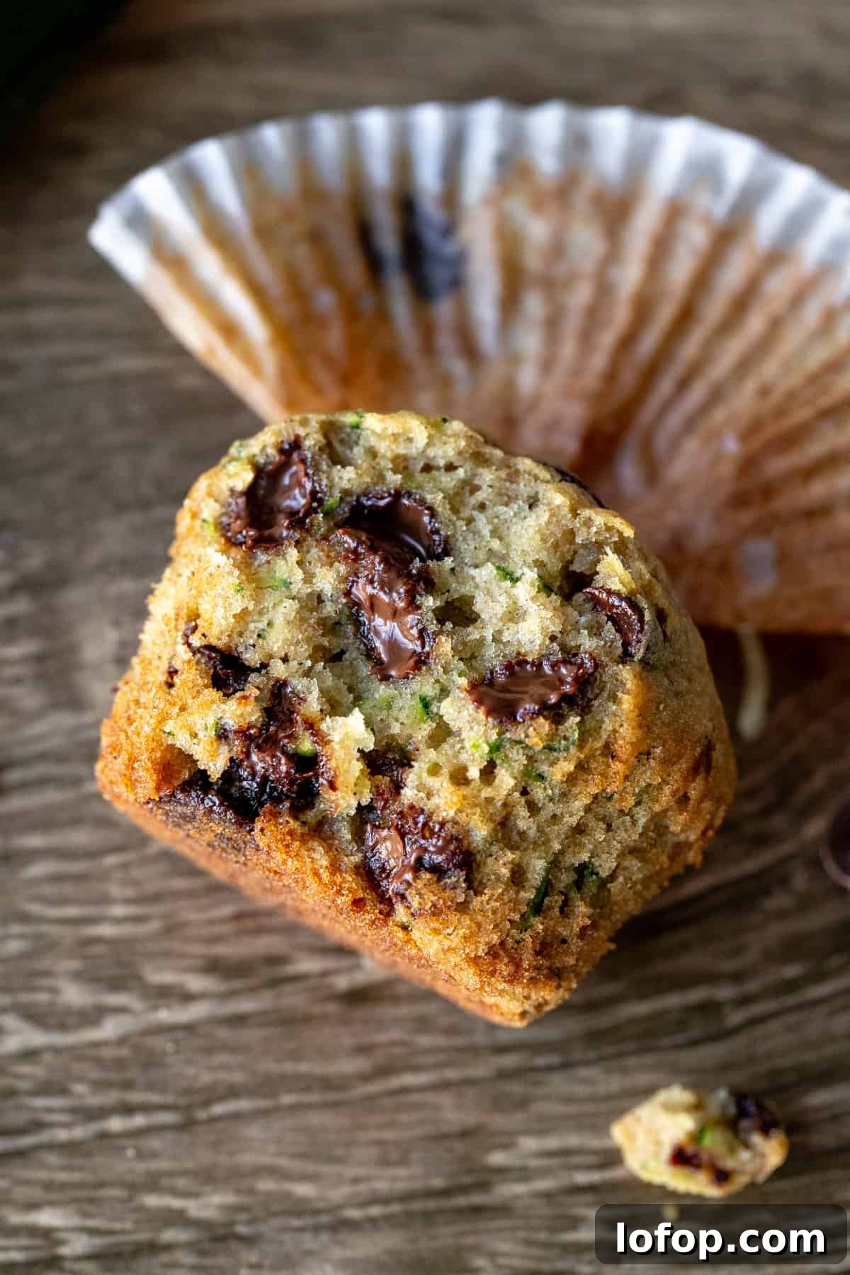 Zucchini muffin with chocolate chips broken in half