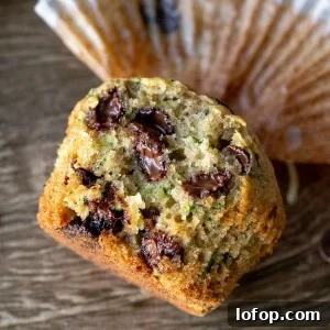 Zucchini muffin with chocolate chips broken in half