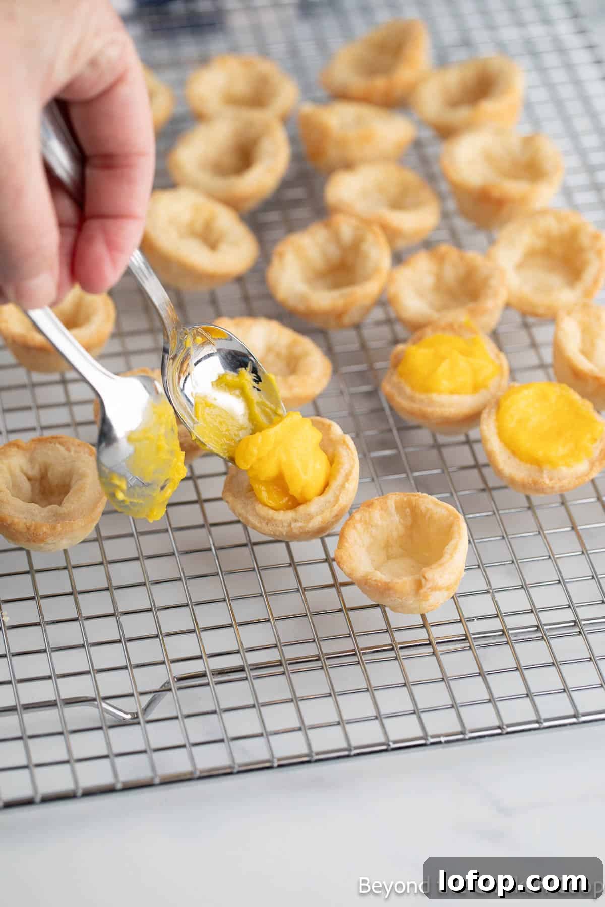 Mini Lemon Tarts Recipe: Zesty Bite-Sized Citrus Pastries 8 Filling mini pie shells with lemon curd.