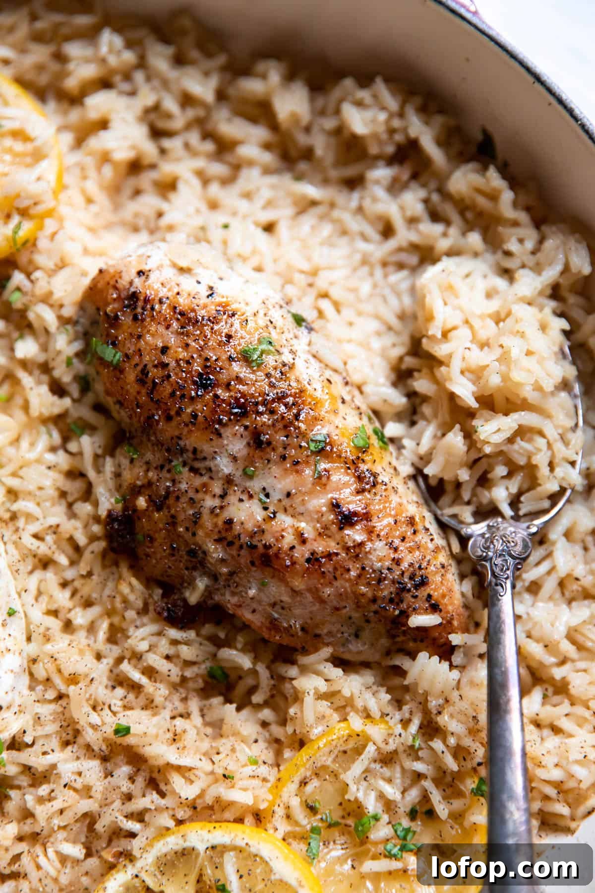 lemon chicken and rice in a pan.