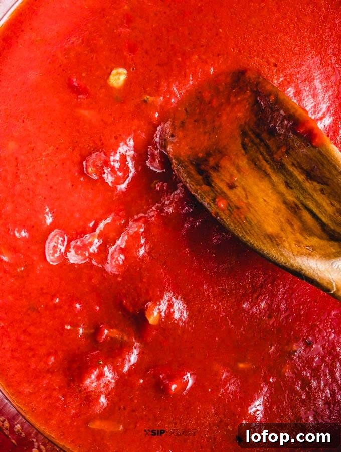 Tomato paste added to the pan.