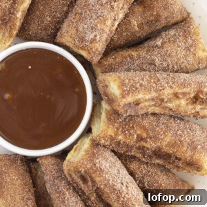 A plate of baked churros, served with salted caramel.