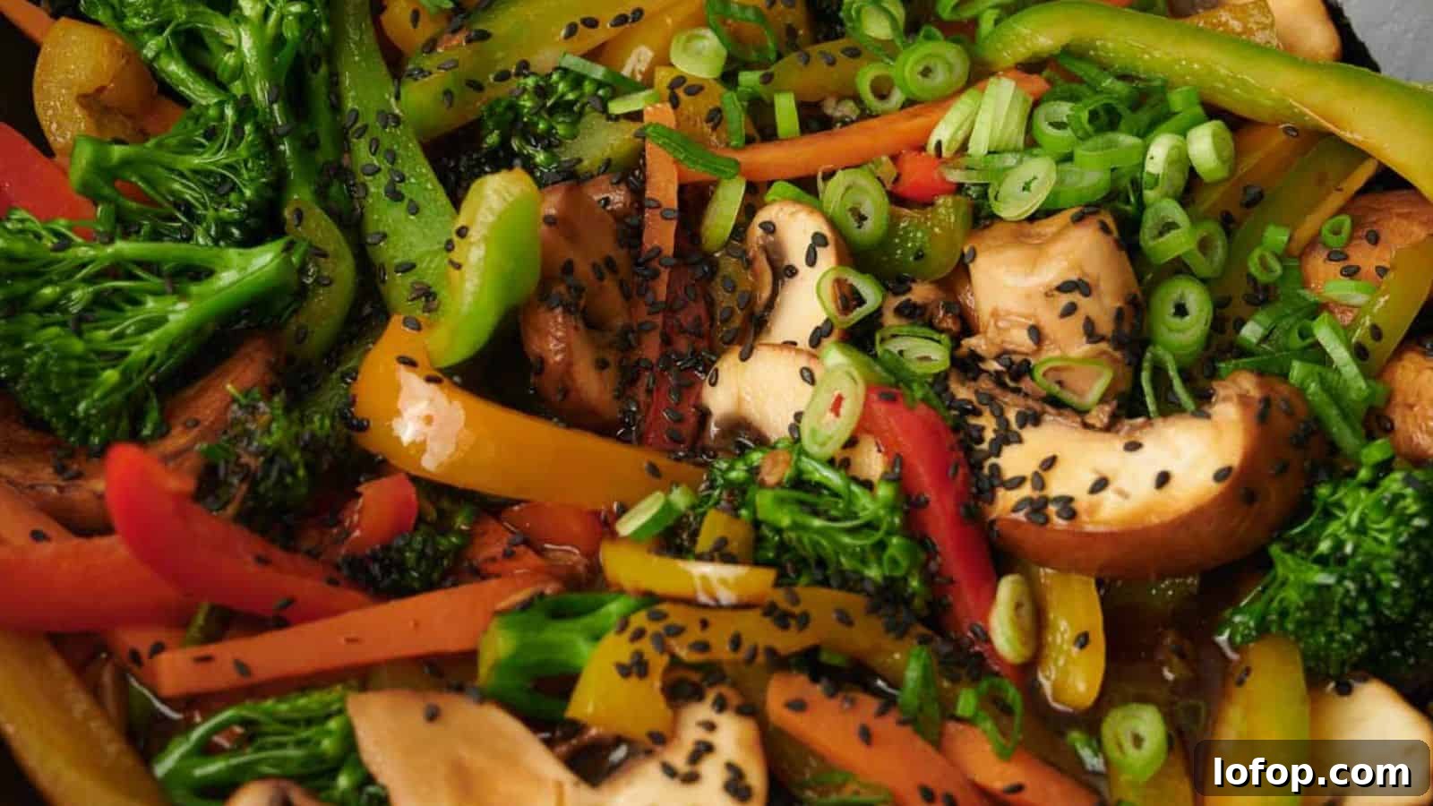 31 Budget-Friendly Winter Meals to Stretch One Grocery Trip Into a Week 17 Colorful vegetable stir fry on a plate.