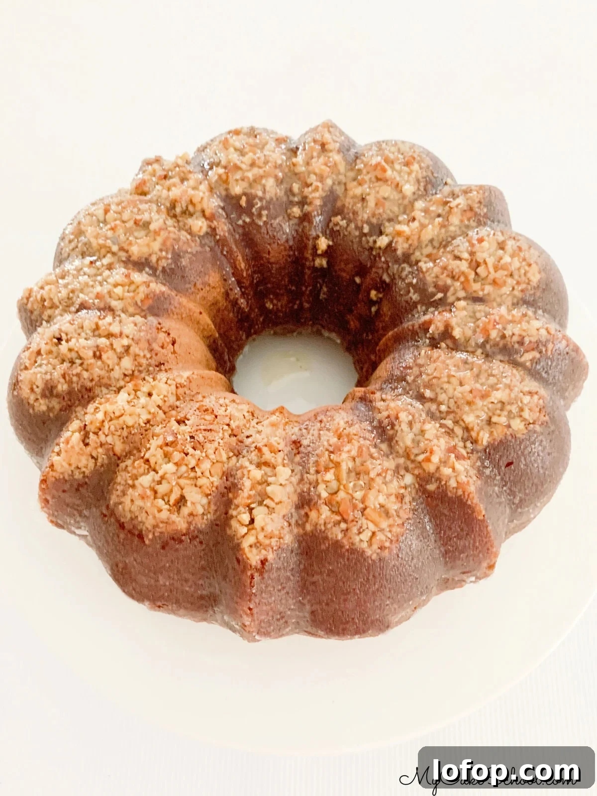 Eggnog Rum Bundt Cake on a cake pedestal.