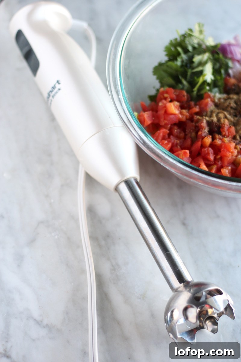 Blender Salsa Recipe: Quick Homemade Fresh Salsa 5 Simple Blender Salsa - a spicy, fresh salsa full of tomatoes, green chilies, cilantro, and lime! Make it in minutes with an immersion blender! | fedandfulfilled.com