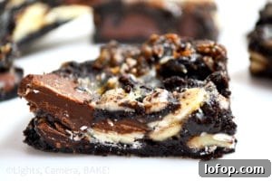 Sticky Triple-Chocolate Oreo Bars (Video) 2 Sticky Triple Chocolate Oreo Bars! These are sticky sweet, ooey gooey, filled with melty chocolate and crushed Oreos! These are a must try!! #gooeyoreobars #triplechocolateoreobars #oreorecipe