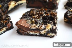 Sticky Triple-Chocolate Oreo Bars (Video) 4 Sticky Triple Chocolate Oreo Bars! These are sticky sweet, ooey gooey, filled with melty chocolate and crushed Oreos! These are a must try!! #gooeyoreobars #triplechocolateoreobars #oreorecipe