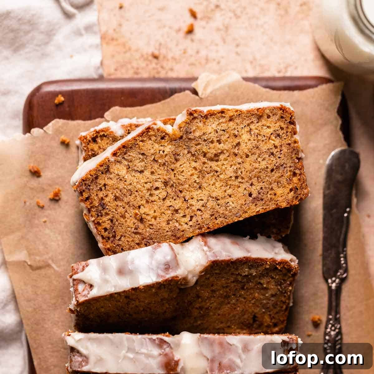 Browned butter banana bread loaf on brown parchment paper.