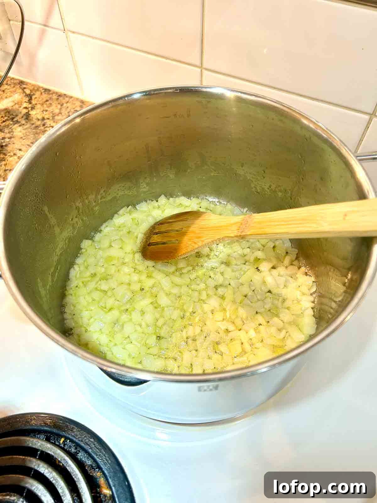 onions and garlic cooking in pot.