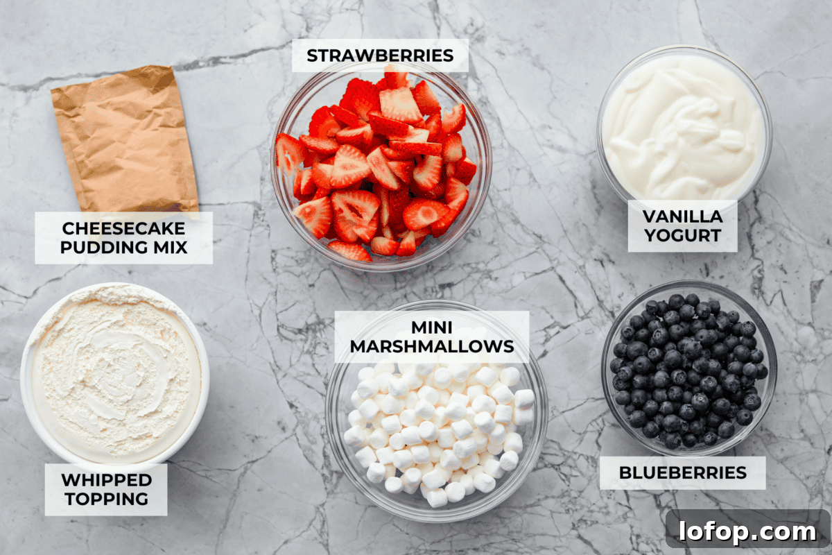 Overhead shot of labeled red white and blue cheesecake salad ingredients. 