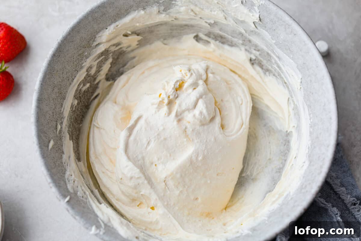 Whipped topping added to the pudding mix and vanilla yogurt. 