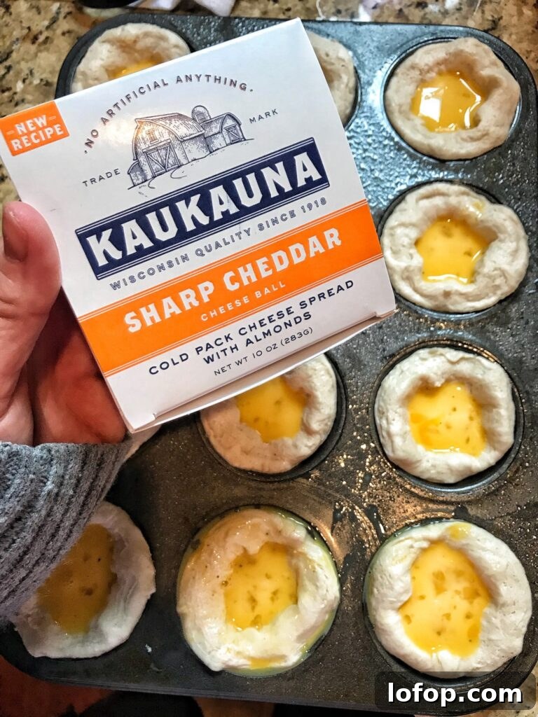 Cheesy Scrambled Egg Breakfast Biscuits Recipe 3 A package of Kaukauna cheddar cheese over raw biscuits