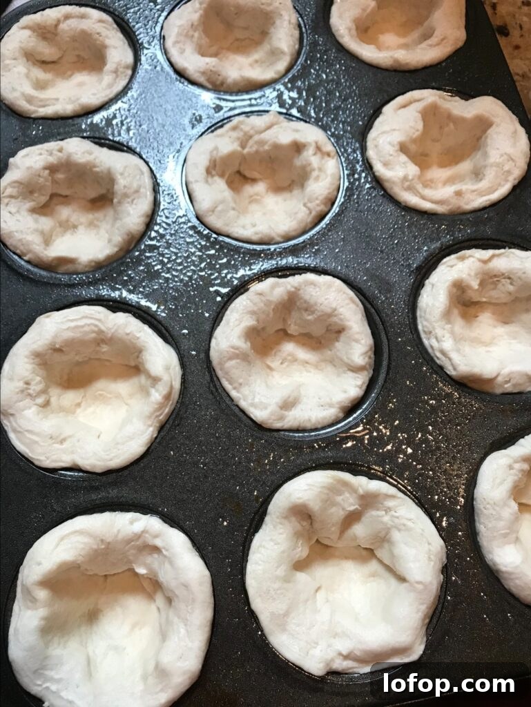 Cheesy Scrambled Egg Breakfast Biscuits Recipe 4 Raw biscuit dough in a muffin tin
