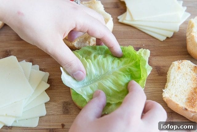 Double Decker Burger Recipe: How to Build a Juicy Stacked Burger 8 Adding Butter Lettuce to Toasted Buns