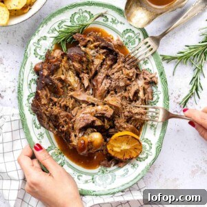 Slow Cooker Leg of Lamb with Garlic and Herbs 12 Slow cooker leg of lamb served shredded with gravy.