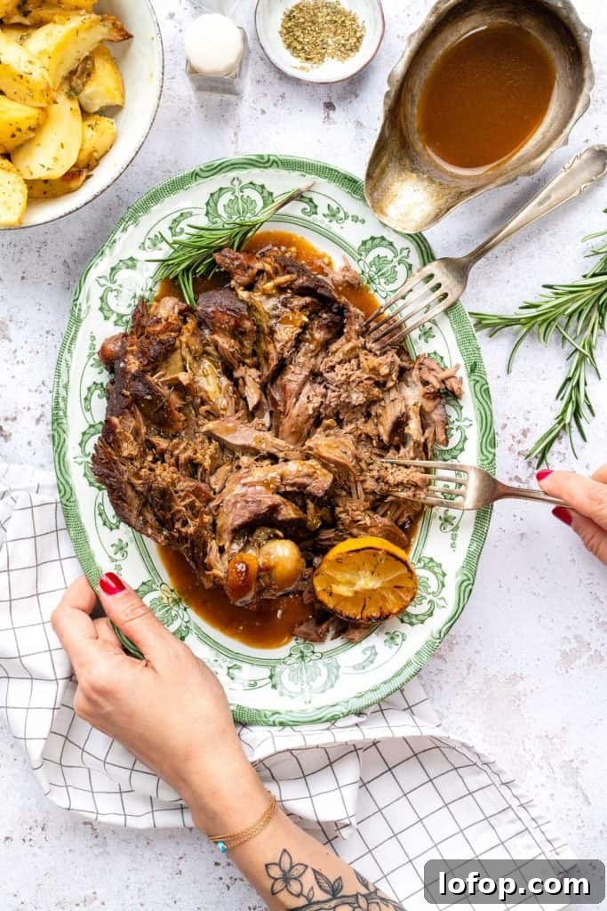 Slow Cooker Leg of Lamb with Garlic and Herbs 7 Tender shredded slow cooker leg of lamb served with rosemary and gravy.