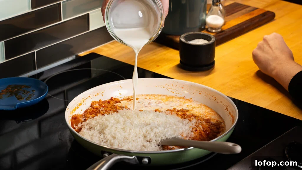 Creamy One-Pot Orzo Pasta Ready in 30 Minutes 5 Adding cream to a delicious creamy orzo pasta recipe.